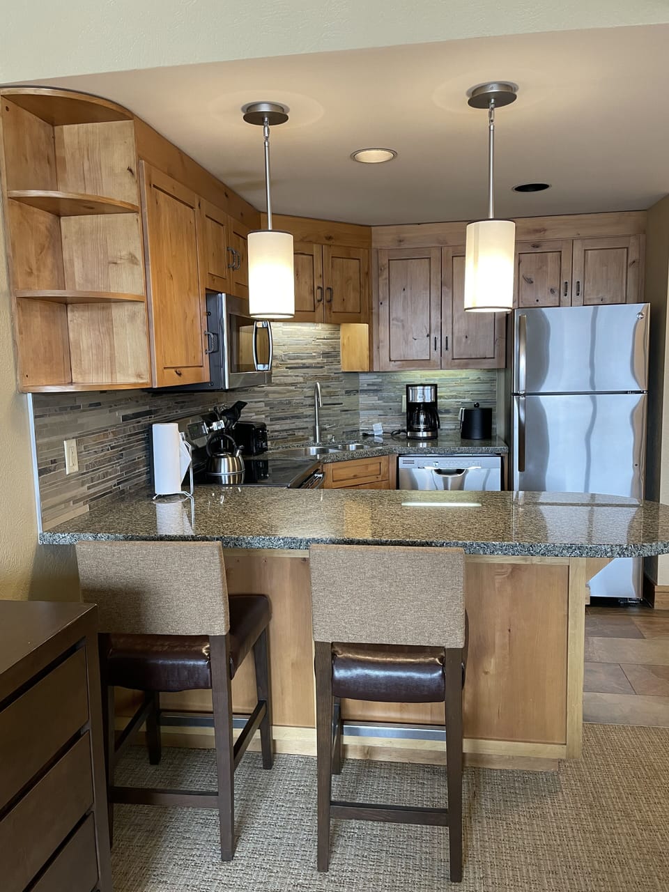 Full kitchen with granite countertops, stainless steel appliances, and everything you need to cook and dine in.