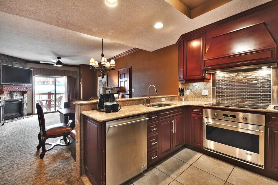 - Cook in a fully equipped kitchen with granite counters  
- Stainless steel appliances make vacation cooking easy  
- Spacious layout opens directly to living and dining areas