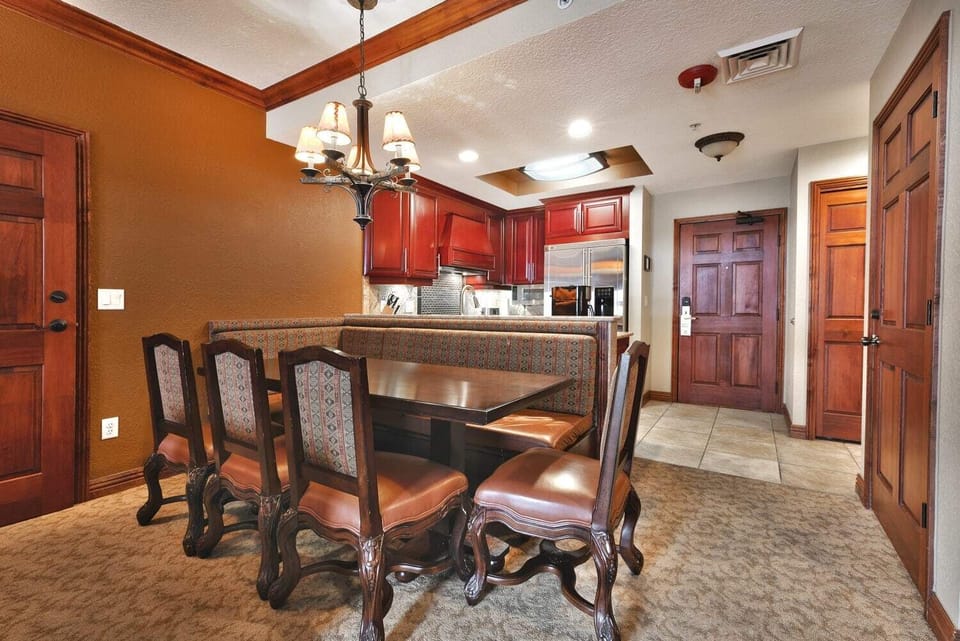 - Share meals in the dining room with seating for six guests  
- Comfortable chairs and cozy lighting set the mood  
- Open-plan layout connects seamlessly to the kitchen