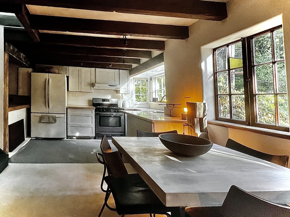 Full kitchen adjacent to living room. Table cozily seats 4 for casual dining.