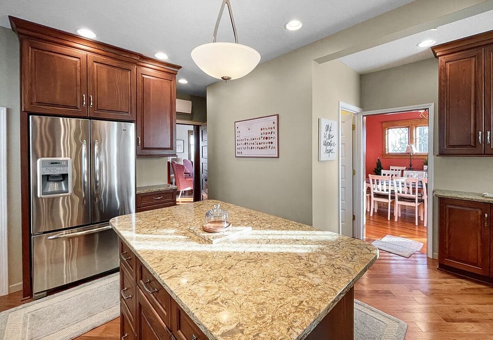 Large kitchen with double door refrigerator w/ ice maker.