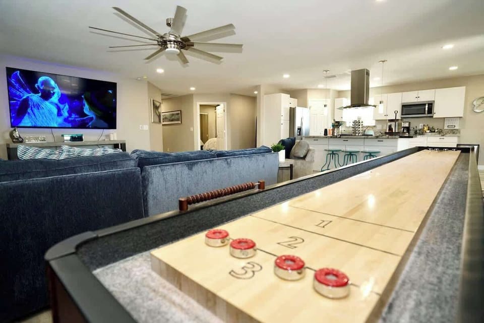 14' shuffleboard table in the living room.