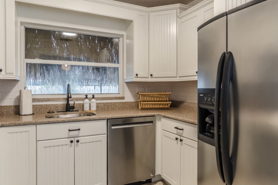 Clean kitchen view highlighting cabinetry and workspace