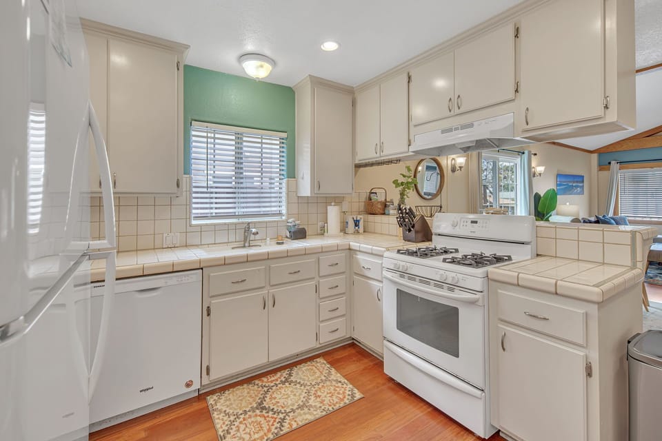 Fully-stocked kitchen with bar stool seating