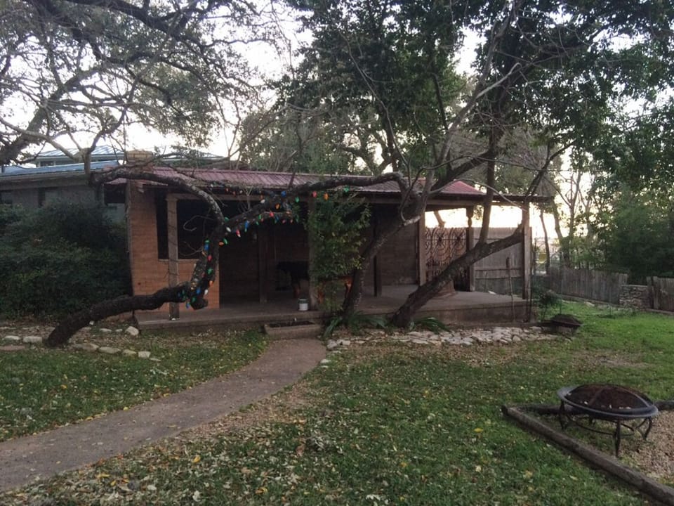 Back covered patio and large yard