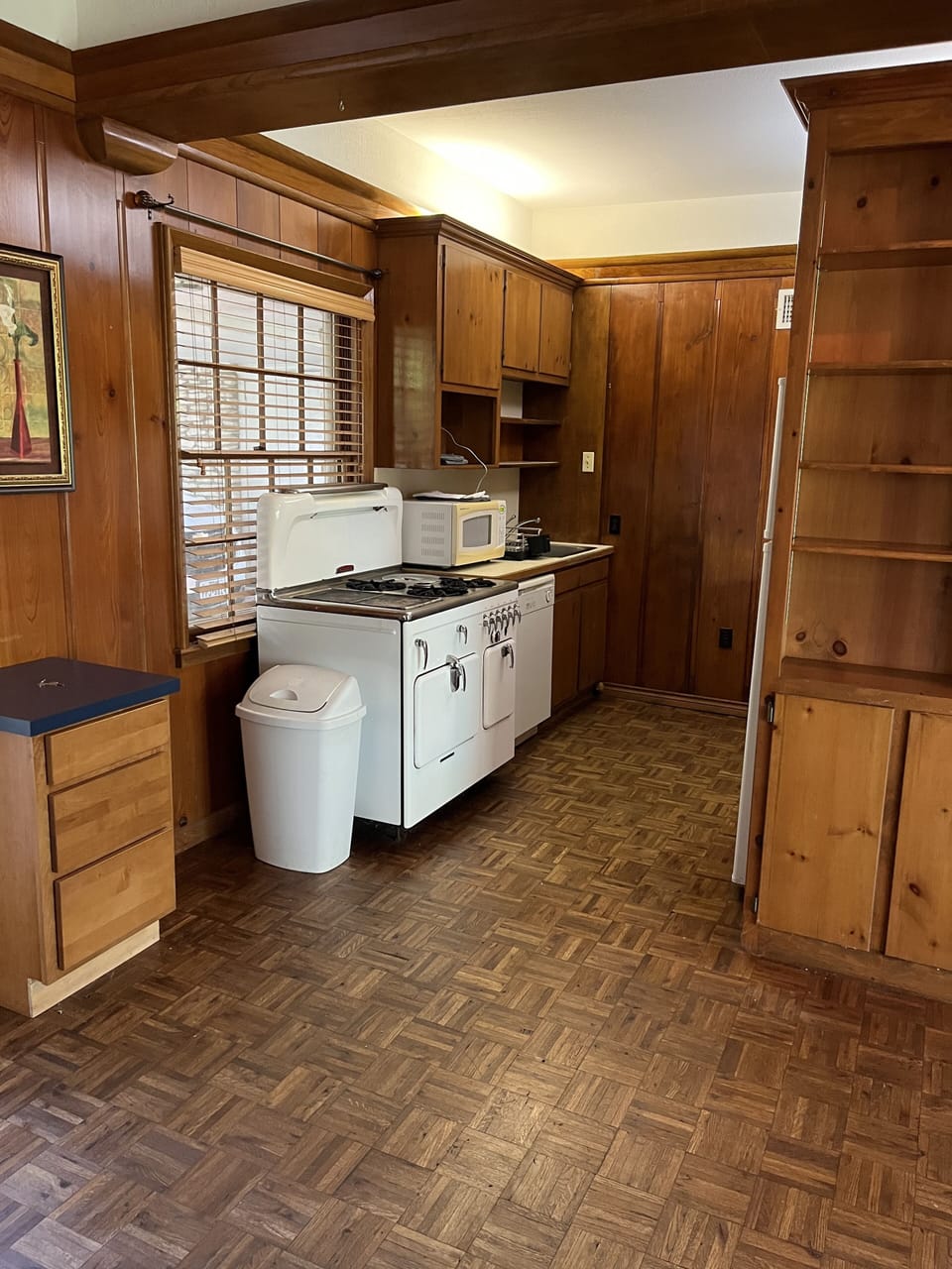 Kitchen with stove, oven and microwave and full sized refrigerator