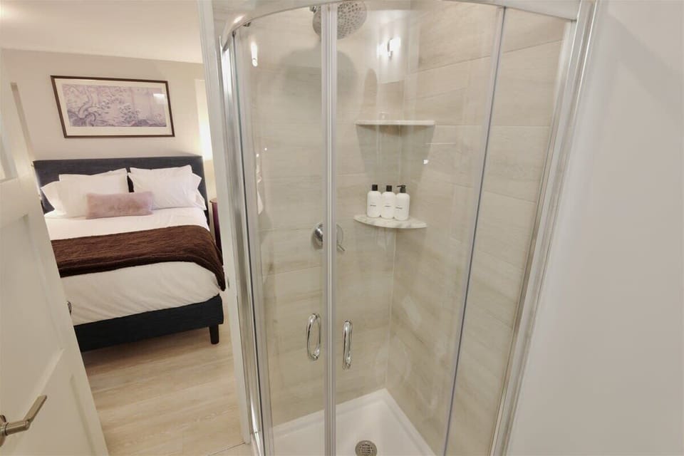 Bathroom has curved European shower doors 