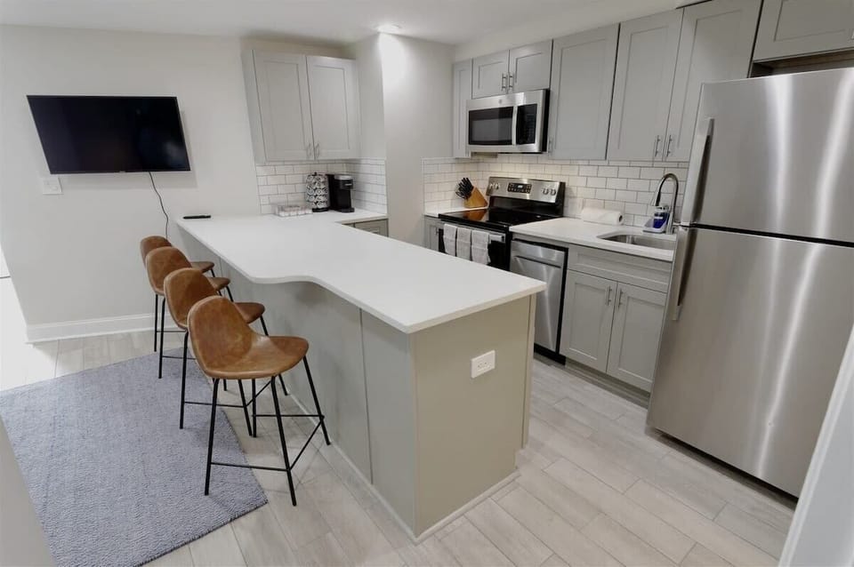 Kitchen island doubles as a laptop friendly workspace 