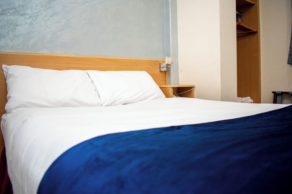 Standard Double Room | Desk, laptop workspace, blackout drapes, iron/ironing board