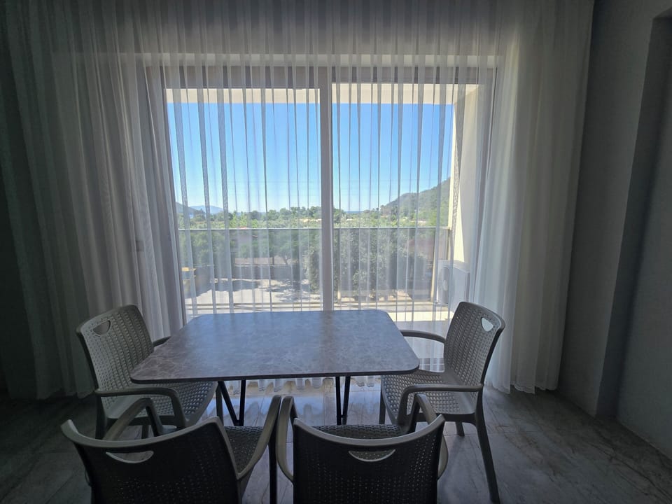 Family Apartment, 1 Bedroom, Non Smoking, Sea View | Living area | 32-inch LED TV with satellite channels, computer monitors
