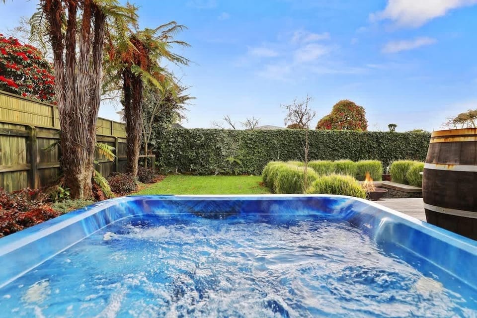 Spa pool and hedged lawn