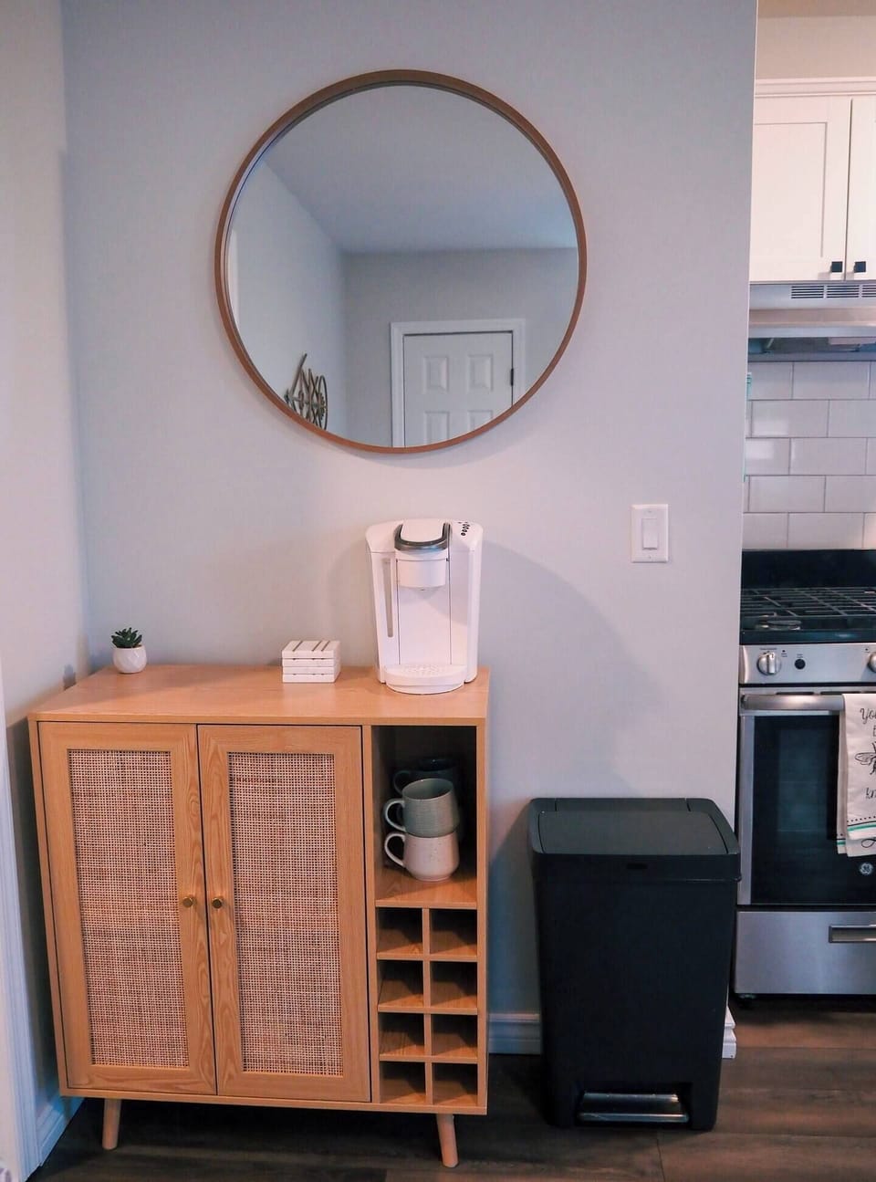 Mugs and K cups can be found in the cabinet below the Keurig.