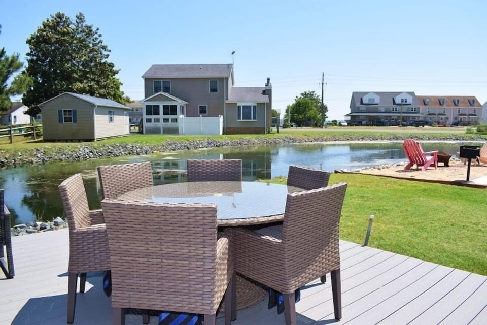 Relax on the back deck overlooking the pond.