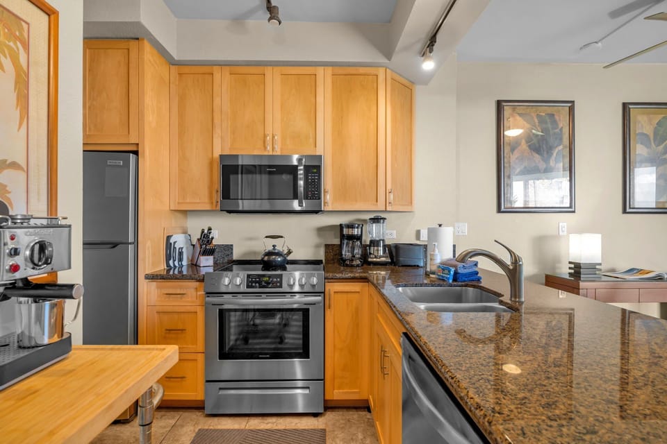 Kitchen features granite countertops and stainless steel appliances