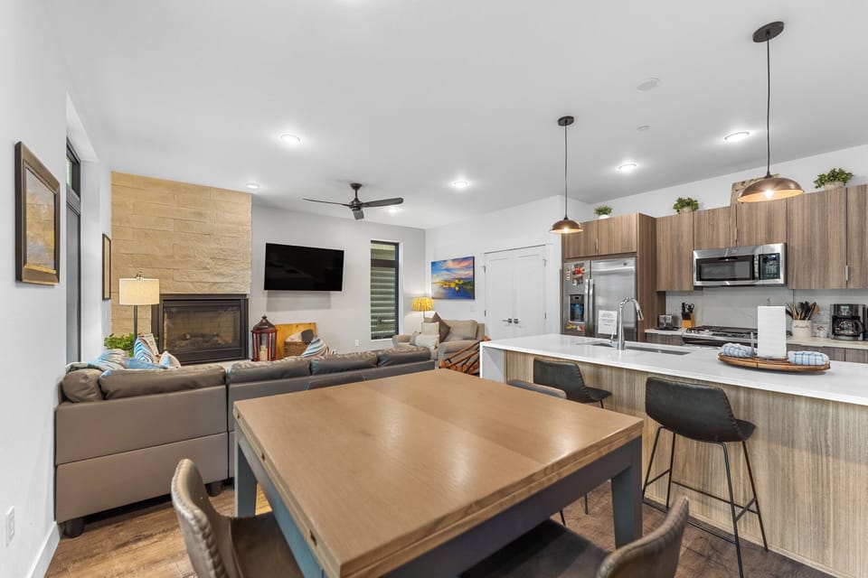 Your modern open-concept kitchen flows seamlessly into the cozy living space, perfect for cooking and relaxing together.