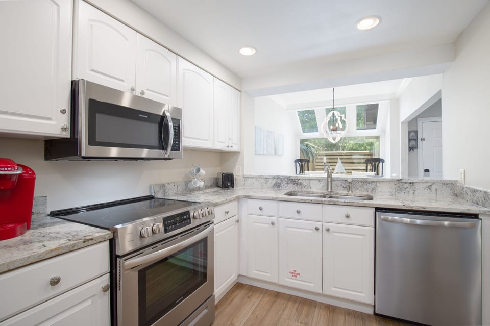 The kitchen is fully equipped with everything you need to cook and enjoy meals during your vacation.
