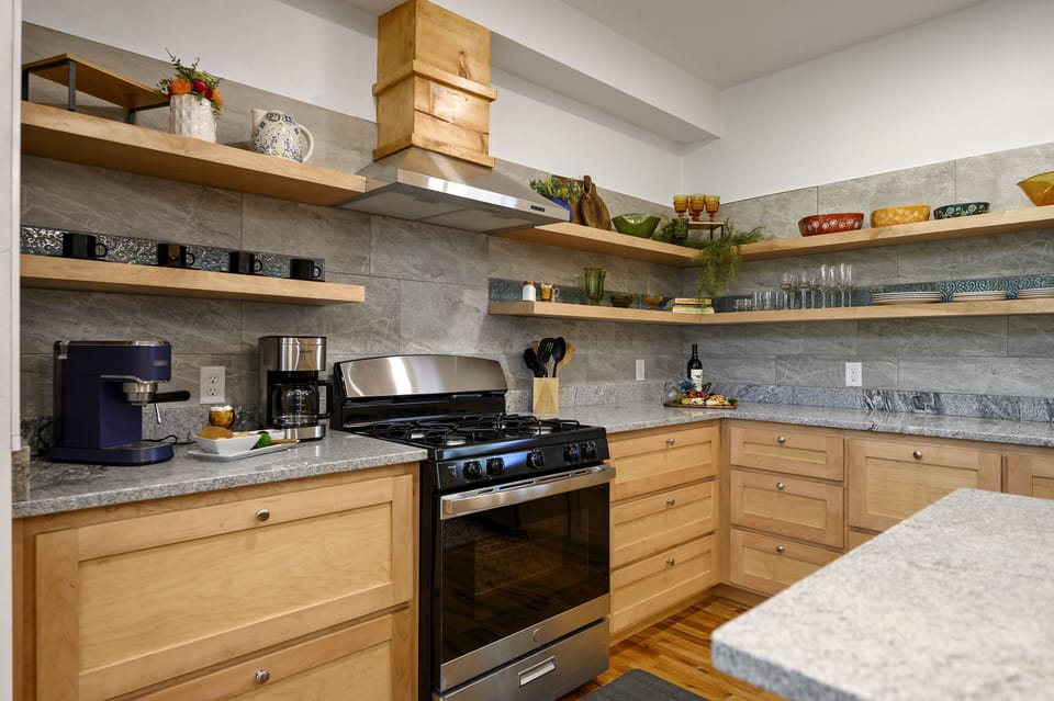 Open shelving system and all the kitchen amenities needed to prepare a meal 