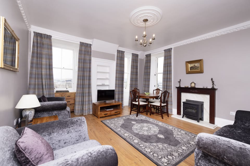 Apartment, 2 Bedrooms | Living area | TV, fireplace