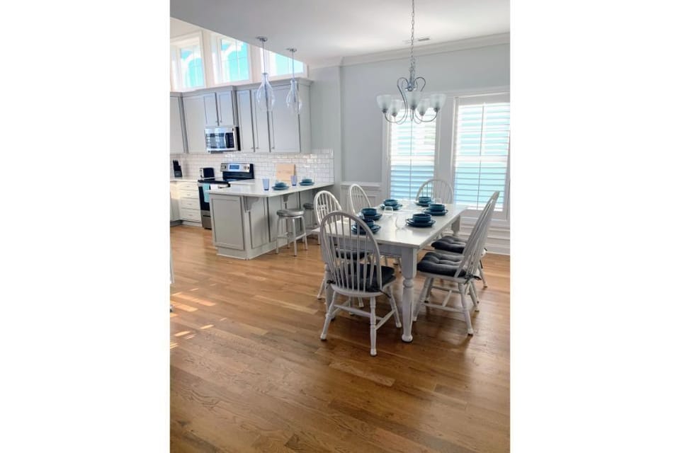 Spacious airy and bright kitchen/dining area with seating for 8 total.