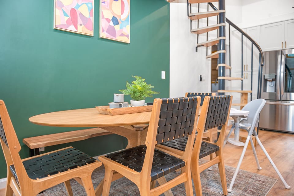 Dining table w/4 chairs and bench seating. High chair located in front closet.