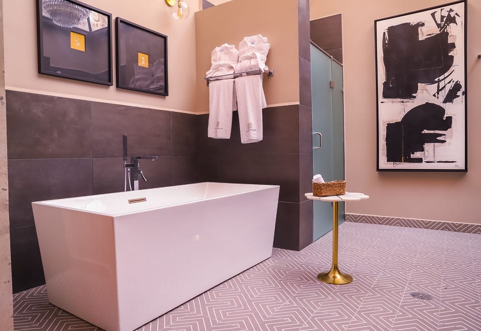 Presidential Studio Suite | Bathroom | Shower, hair dryer, bathrobes, towels