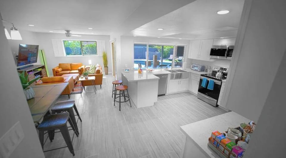 Living room #2 and adjoining kitchen with soft water! Go0gle asst voice console.