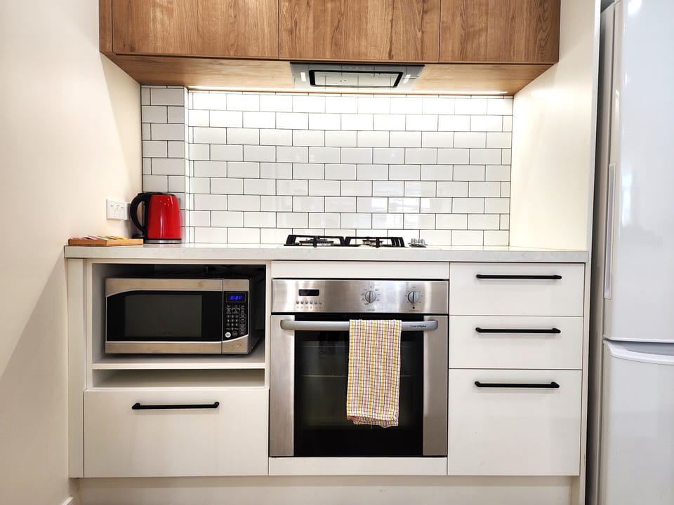 Apartment | Private kitchen | Full-size fridge, microwave, oven, stovetop