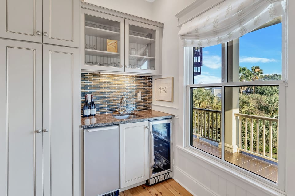 Additional beverage fridge and wet bar.