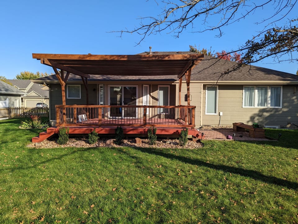 Back yard with deck, pergola, and paver patio. Fenced in for pets! 