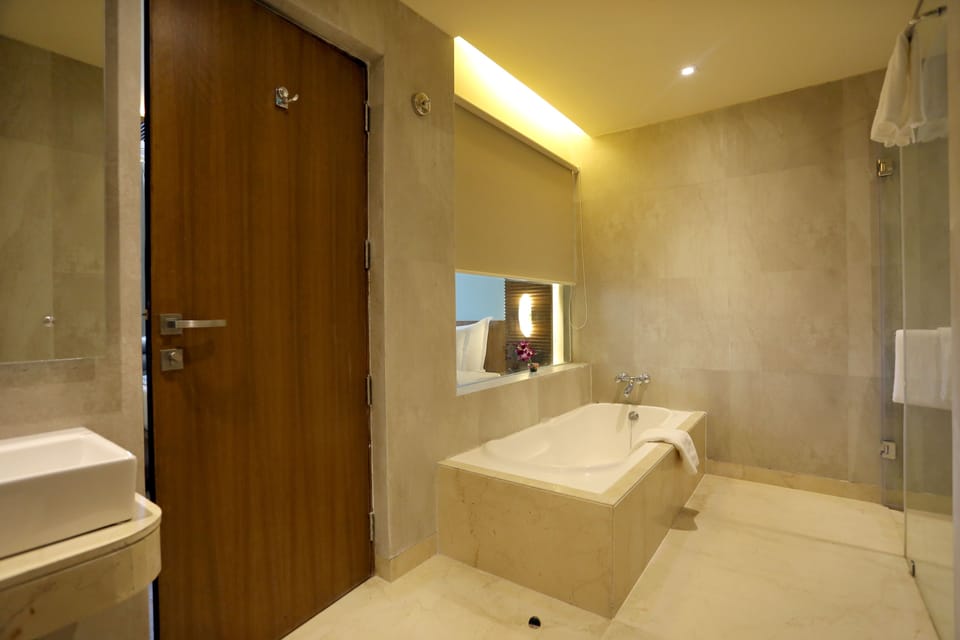 Designer toiletries, hair dryer, bathrobes, slippers