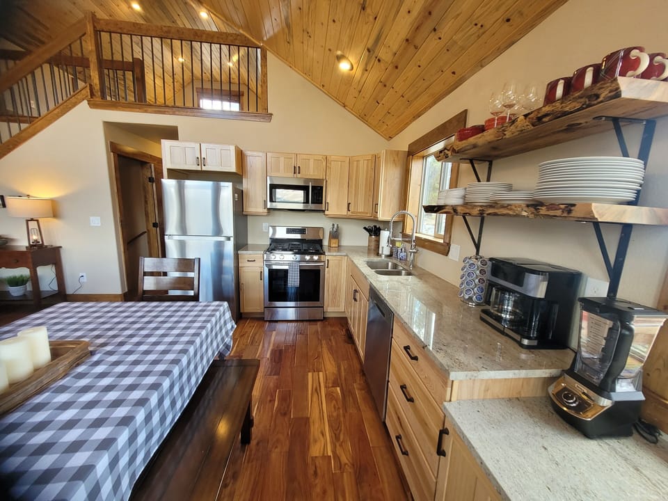 There is ample counter space and open shelving throughout the open Kitchen