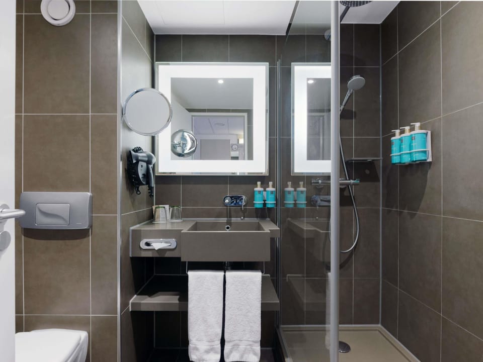 Shower, eco-friendly toiletries, hair dryer, towels
