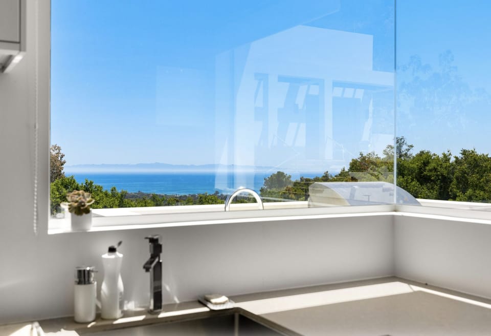 Indoor/ outdoor kitchens overlooking the Pacific.