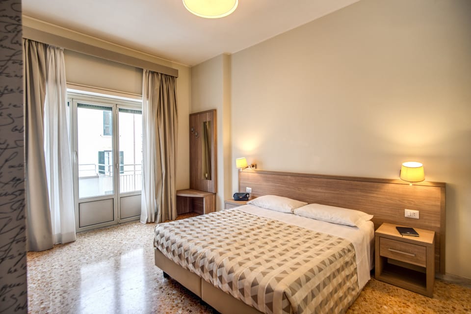 Deluxe Quadruple Room, Balcony | Bathroom | Shower, hair dryer, bidet, towels