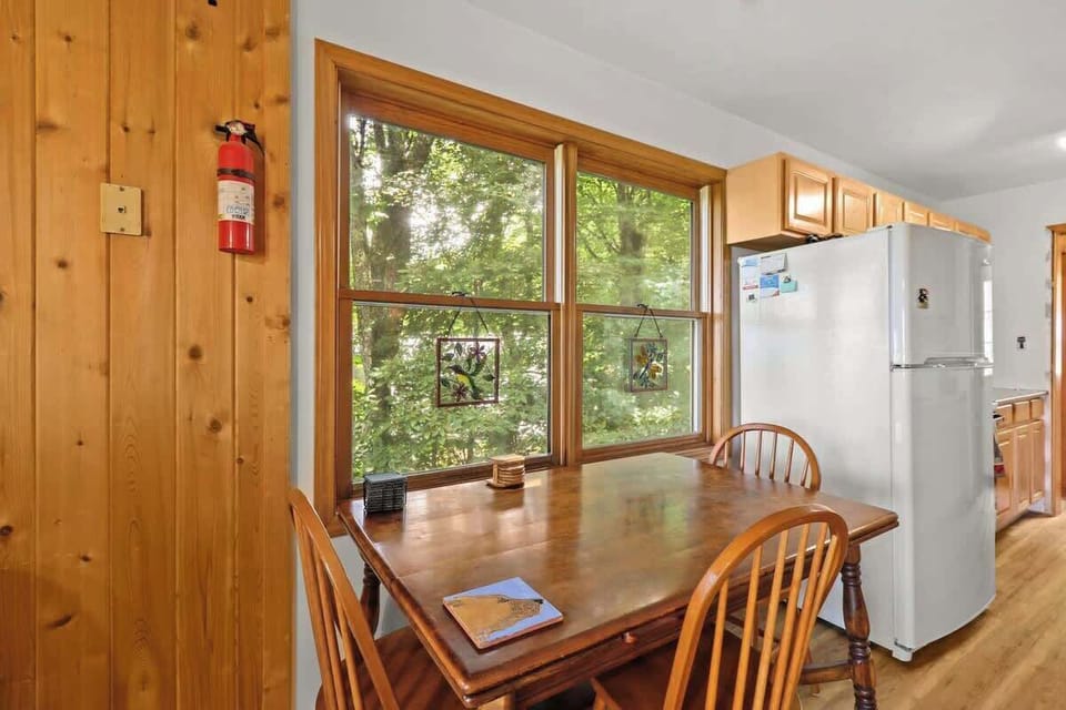 Display your delectable, homemade dishes on the wooden dining table.