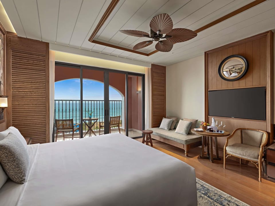 Deluxe Room, 1 King Bed, Sea View | Minibar, in-room safe, soundproofing, iron/ironing board