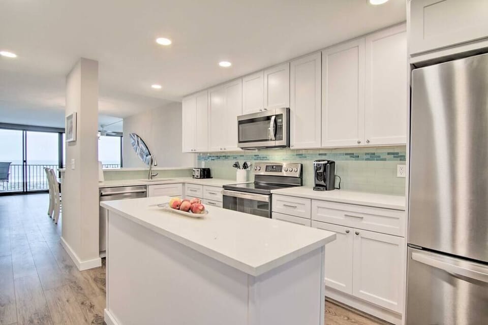 New renovated kitchen with views of the beach and ocean.