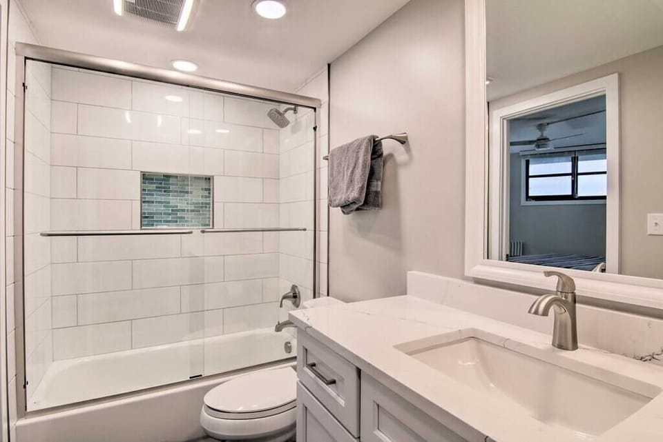 Renovated hall bath has access to the second bedroom and the hallway.