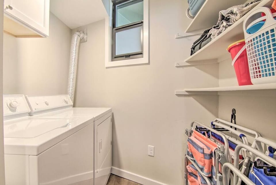 Laundry with beach chairs and beach toys.