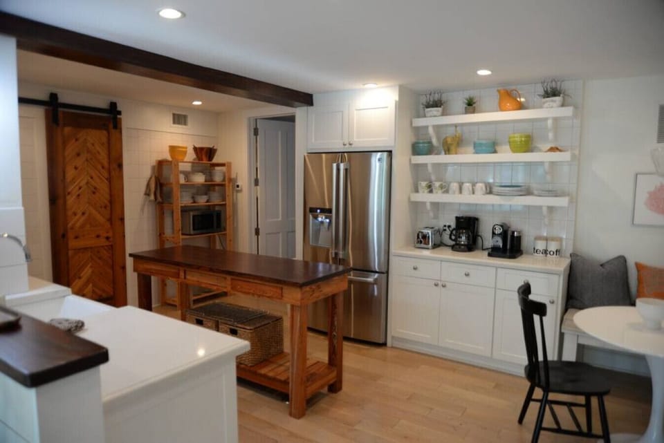 Kitchen, barn door in photo leads to laundry and half bath.
