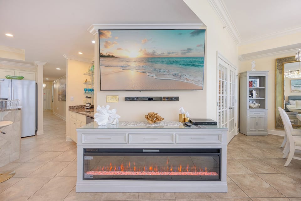 Cozy up in front of the glowing fireplace and enjoy family movie nights with your favorite shows on the big screen