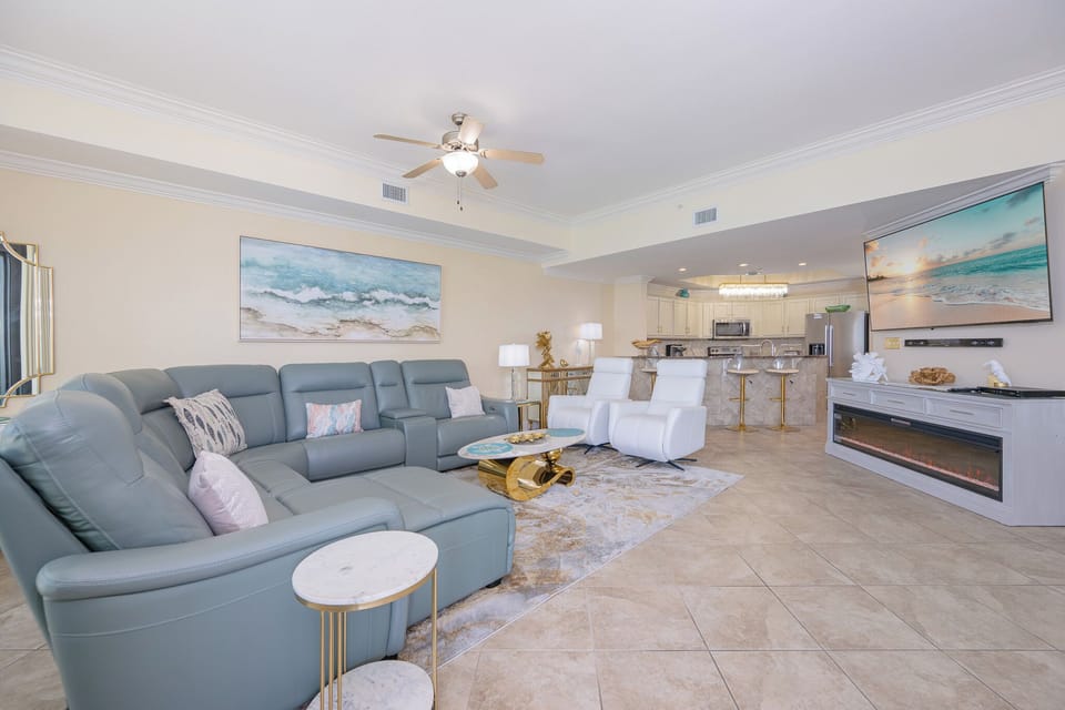 Sink into plush seating and enjoy movie nights together with family, surrounded by coastal charm and modern design