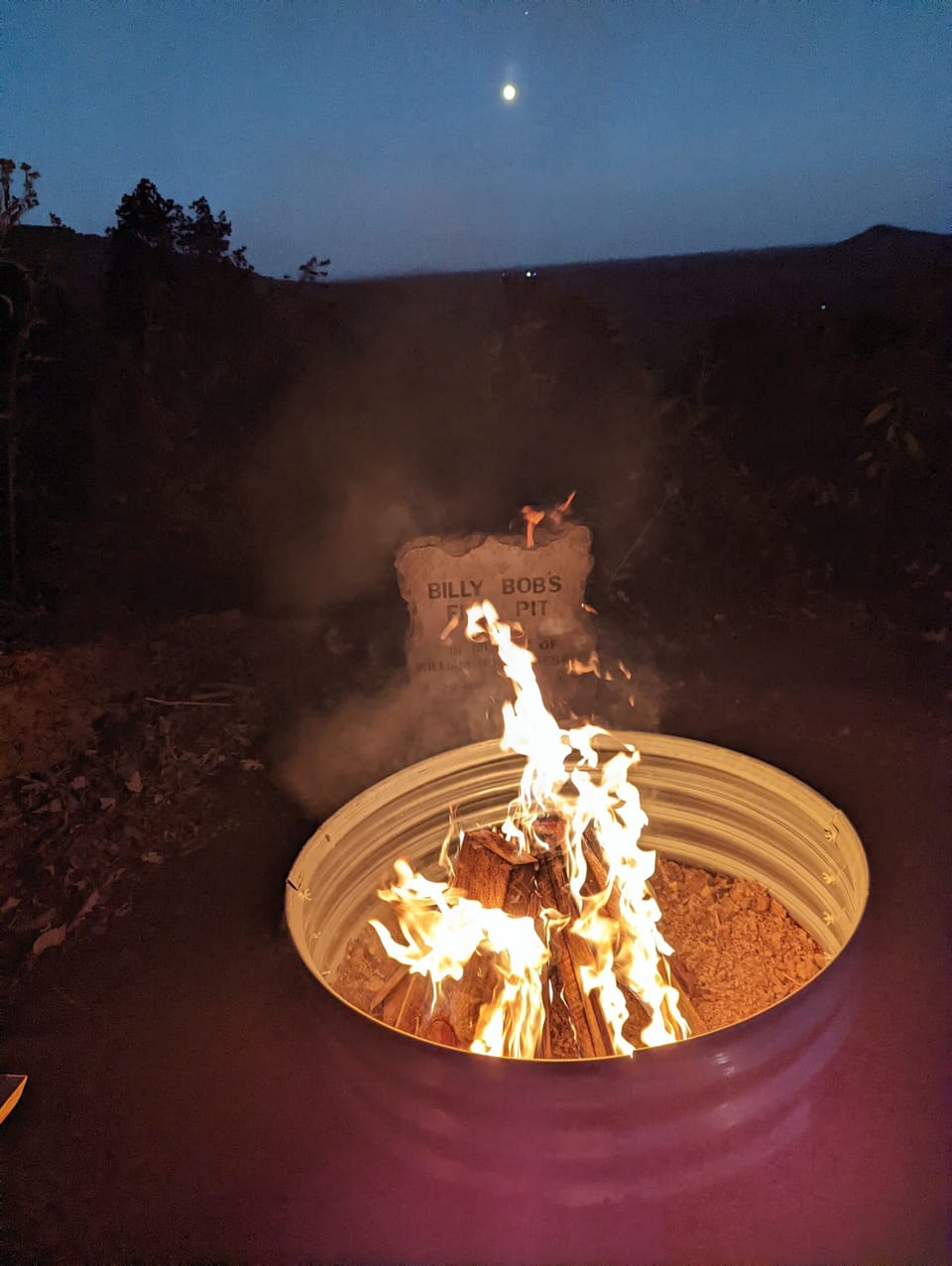 Firepit at night (notice the full moon rising!)
