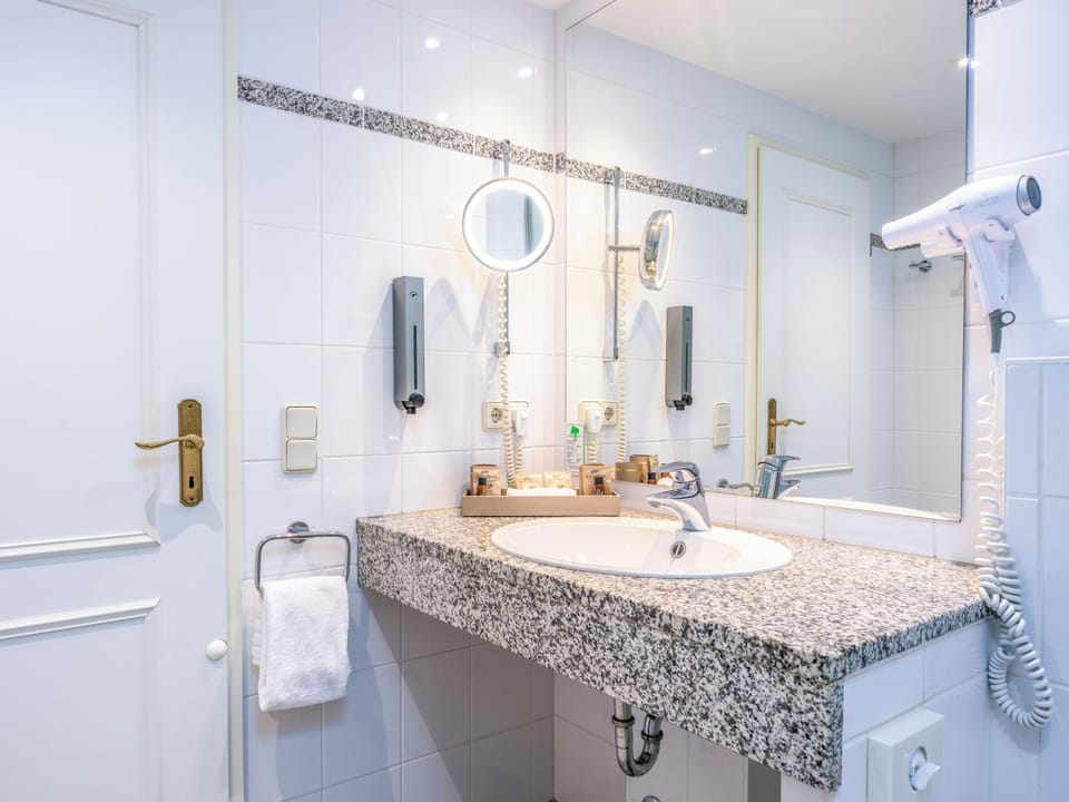 Shower, eco-friendly toiletries, hair dryer, towels