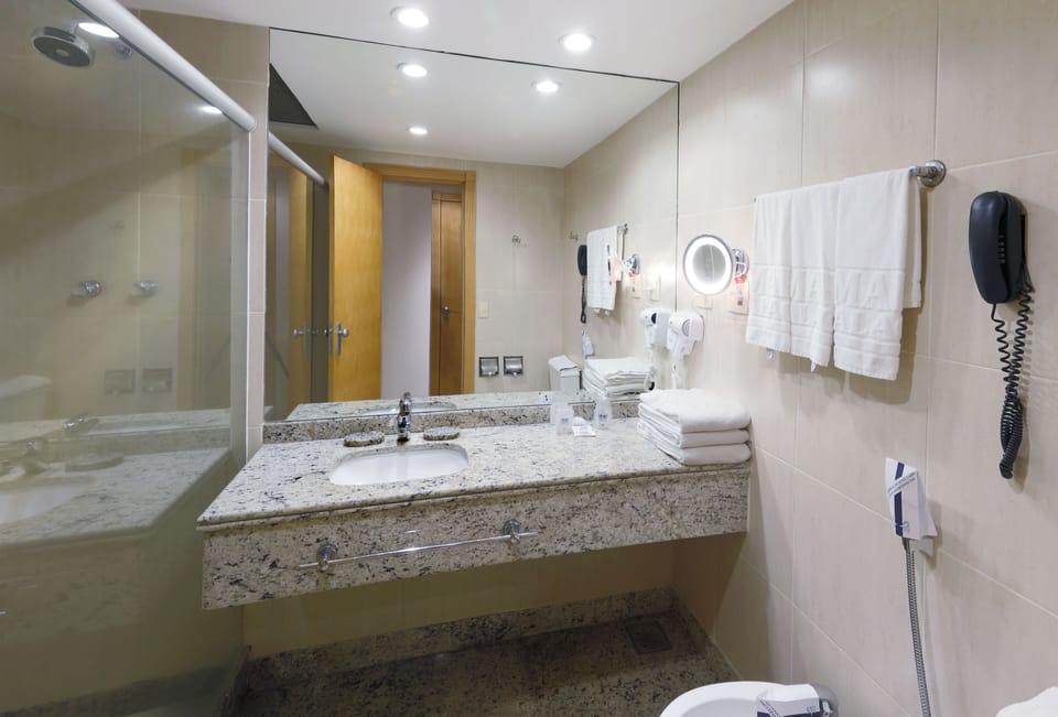 Shower, hair dryer, towels, shampoo