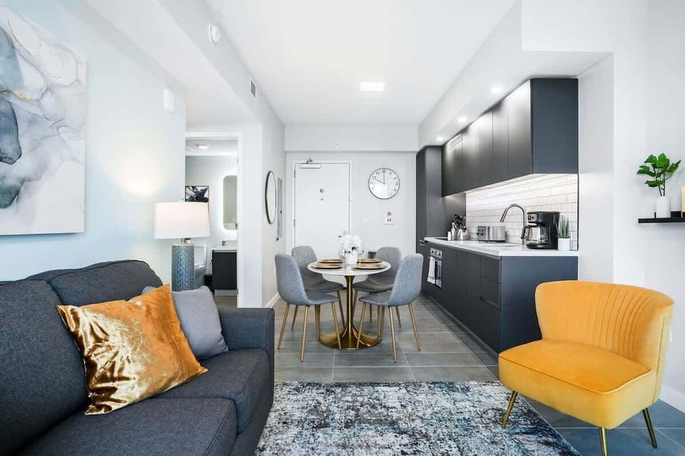 Living/dining area - This open layout of the dining and living room is professionally designed and decorated to give our guests airy feel throughout the home.