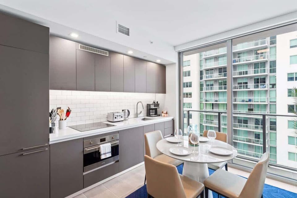 Gourmet Hub: Experience Culinary Delights in our Fully Equipped Kitchen, Seamlessly Integrated with the Vibrant Dining/Living Space.