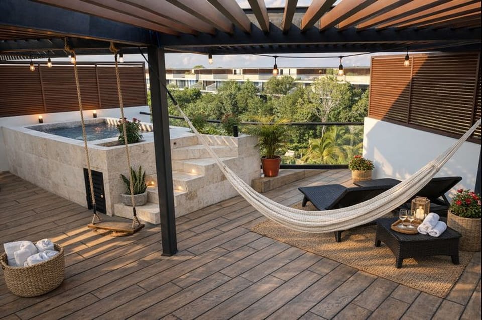 Private rooftop terrace with plunge pool, hammock, and lounge seating
