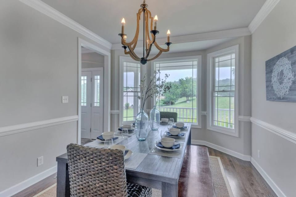 Dining room off kitchen which comfortably seats 8 (2 end chairs and 2 side benches). Combined with kitchen seating, can feed 13 inside