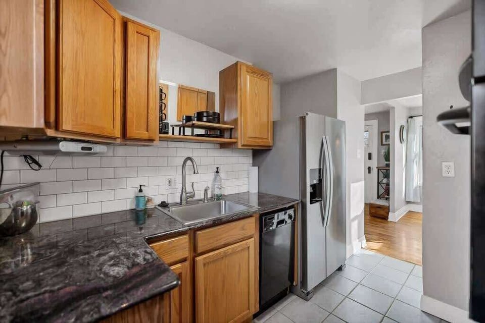 The kitchen is fully equipped with all of the necessary appliances for cooking breakfast, lunch, and dinner.